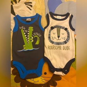 Two bodysuits (blue one is 0-3m) (white one is 3-6m)